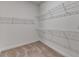 Spacious walk-in closet with neutral carpet and white wire shelving at 2505 Whistler Way Ne, Lawrenceville, GA 30043