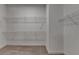 Walk-in closet with carpet and white wire shelving for ample storage space at 2505 Whistler Way Ne, Lawrenceville, GA 30043