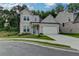 Charming two-story home featuring a manicured lawn and a two-car garage at 2505 Whistler Way Ne, Lawrenceville, GA 30043