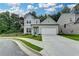 Charming two-story home featuring a manicured lawn and a two-car garage at 2505 Whistler Way Ne, Lawrenceville, GA 30043
