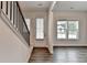Inviting foyer with wood floors and natural light. Staircase to the left of the entryway at 2505 Whistler Way Ne, Lawrenceville, GA 30043