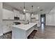 Modern kitchen with white cabinets, stainless steel appliances, and large island at 2505 Whistler Way Ne, Lawrenceville, GA 30043