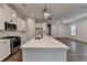 Beautiful kitchen with a spacious center island and stainless steel appliances open to the living area at 2505 Whistler Way Ne, Lawrenceville, GA 30043