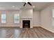 Living room with wood floors, fireplace and ceiling fan at 2505 Whistler Way Ne, Lawrenceville, GA 30043