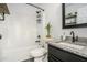 Modern bathroom features a granite countertop and a shower with sleek black fixtures at 267 Rocky Point Rd, Covington, GA 30014