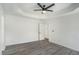 Bright and airy bedroom with tray ceiling and modern ceiling fan at 267 Rocky Point Rd, Covington, GA 30014