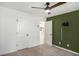 A charming bedroom with a ceiling fan, closet, and open door to another room at 267 Rocky Point Rd, Covington, GA 30014