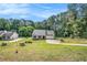 Traditional-style home featuring lush lawn, attached garage and separate oversized garage at 267 Rocky Point Rd, Covington, GA 30014