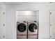 Convenient laundry area with modern washer and dryer units at 267 Rocky Point Rd, Covington, GA 30014