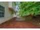 Landscaped backyard with mulch and a paved patio area, offering a serene outdoor retreat at 3075 Oakvale Hts, Decatur, GA 30034
