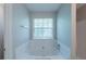 Tub and shower combination featuring a single hung window at 3075 Oakvale Hts, Decatur, GA 30034