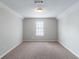 Carpeted bedroom with window and neutral color scheme at 3075 Oakvale Hts, Decatur, GA 30034