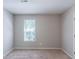 Bedroom featuring neutral carpeting, a window, and fresh neutral paint at 3075 Oakvale Hts, Decatur, GA 30034