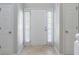 Bright entryway featuring a white front door, sidelights, and neutral-toned flooring at 3075 Oakvale Hts, Decatur, GA 30034