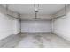 Spacious garage featuring a gray automatic door with overhead storage racks, ready for vehicles and storage at 3075 Oakvale Hts, Decatur, GA 30034