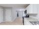 Bright kitchen with stainless appliances, stone counters, and tile flooring at 3075 Oakvale Hts, Decatur, GA 30034