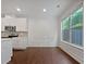 An open dining space featuring wood floors and large windows for natural light at 44 Trailview Ln # 78, Hiram, GA 30141