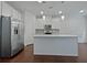 Well-lit kitchen featuring stainless steel appliances, white cabinets, and a large kitchen island at 44 Trailview Ln # 78, Hiram, GA 30141