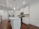 An open concept kitchen featuring an island, stainless appliances, and white cabinetry at 44 Trailview Ln # 78, Hiram, GA 30141