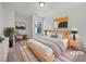 Comfortable bedroom featuring a cozy bed with nightstands, carpet flooring, and lots of natural light at 44 Trailview Ln # 78, Hiram, GA 30141