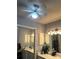 Bright bathroom features dual sinks, mirrored cabinets, and a modern ceiling fan at 104 Abingdon Way, Atlanta, GA 30328