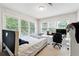 Cozy bedroom with natural light, a full-sized bed, and a dedicated workspace at 104 Abingdon Way, Sandy Springs, GA 30328