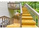 Wooden stairs leading to the back deck with access to the serene, private backyard at 138 Hartwood Dr, Woodstock, GA 30189