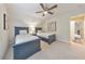 Comfortable bedroom featuring two beds, neutral walls, and a ceiling fan at 138 Hartwood Dr, Woodstock, GA 30189