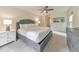 Spacious bedroom with neutral decor, ensuite bath, and lots of natural light at 138 Hartwood Dr, Woodstock, GA 30189