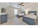 Cozy bedroom with two blue beds, a dresser, neutral walls, and a ceiling fan at 138 Hartwood Dr, Woodstock, GA 30189
