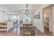 Bright dining area adjoins kitchen with deck access, powder room nearby at 138 Hartwood Dr, Woodstock, GA 30189