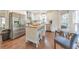 Well-lit kitchen features stainless steel appliances, island, and breakfast nook at 138 Hartwood Dr, Woodstock, GA 30189