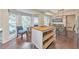 Kitchen with center island, stainless appliances, breakfast nook, and lots of natural light at 138 Hartwood Dr, Woodstock, GA 30189