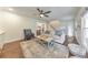 Bright living room with hardwood floors, shiplap wall accents, and neutral decor at 138 Hartwood Dr, Woodstock, GA 30189