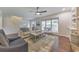 Cozy living room with large windows, neutral colors, and comfortable seating at 138 Hartwood Dr, Woodstock, GA 30189