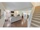 Bright living room boasts hardwood floors, built-in shelves, and an open layout to the dining area at 138 Hartwood Dr, Woodstock, GA 30189