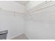 Empty walk-in closet features white walls, neutral carpet, and installed wire shelving at 138 Hartwood Dr, Woodstock, GA 30189