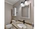 Cozy bathroom with granite countertop, white cabinets and modern fixtures at 1486 Maple Ridge Dr, Suwanee, GA 30024