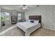 Relaxing bedroom with patterned wallpaper, two windows, and a comfortable bed with a unique headboard design at 1486 Maple Ridge Dr, Suwanee, GA 30024