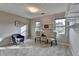 Bedroom with two chairs, two windows, and ample storage space with built in shelves, perfect for relaxing and reading at 1486 Maple Ridge Dr, Suwanee, GA 30024