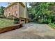 Beautiful brick home featuring a two-car garage, complemented by lush landscaping and a long driveway at 1486 Maple Ridge Dr, Suwanee, GA 30024