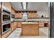 Bright kitchen featuring a central island, stainless appliances, and generous cabinet space at 1486 Maple Ridge Dr, Suwanee, GA 30024
