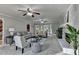 Spacious living room with brick fireplace, plush gray carpet, neutral paint and lots of natural light at 1486 Maple Ridge Dr, Suwanee, GA 30024