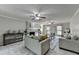 Cozy living room featuring a fireplace, large windows, and comfortable seating at 1486 Maple Ridge Dr, Suwanee, GA 30024