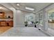 Bright sunroom with skylights, large windows, and access to a deck, perfect for enjoying natural light at 1486 Maple Ridge Dr, Suwanee, GA 30024