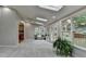 Inviting sunroom with skylights, offering a bright and airy atmosphere with seamless transition to the outdoors at 1486 Maple Ridge Dr, Suwanee, GA 30024