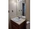 Bathroom features a vanity with mirror and a view to the shower at 604 Pepperwood Ln, Stone Mountain, GA 30087