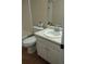 Bathroom featuring a toilet, vanity with sink, and a mirror at 604 Pepperwood Ln, Stone Mountain, GA 30087