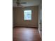 Bedroom features hardwood floors and a window at 604 Pepperwood Ln, Stone Mountain, GA 30087