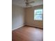 This bedroom features hardwood floors and a ceiling fan for added comfort at 604 Pepperwood Ln, Stone Mountain, GA 30087